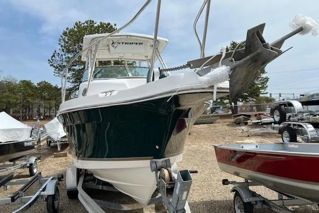 Slide: The Image of 2006 Striper 2301 Walkaround OB boat on trailer, parked outdoors. - 2