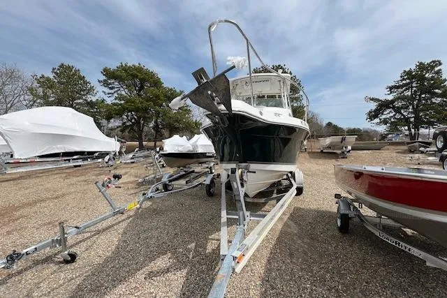 Slide: The Image of 2006 Striper 2301 Walkaround OB boat on trailer, parked outdoors. - 29