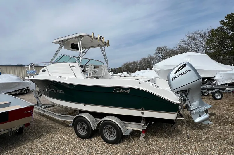 Slide: The Image of 2006 Striper 2301 Walkaround OB boat with Honda outboard motor on trailer. - 3