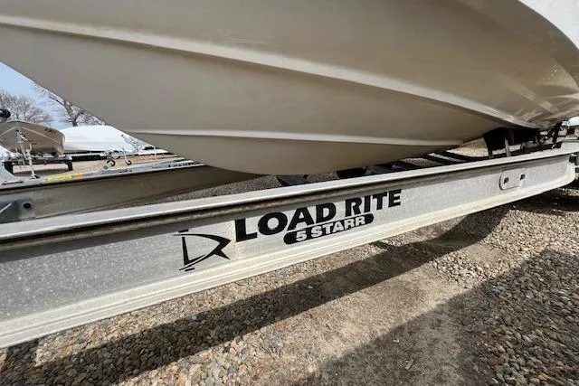 Slide: The Image of 2006 Striper 2301 Walkaround OB on Load Rite trailer, side view. - 31