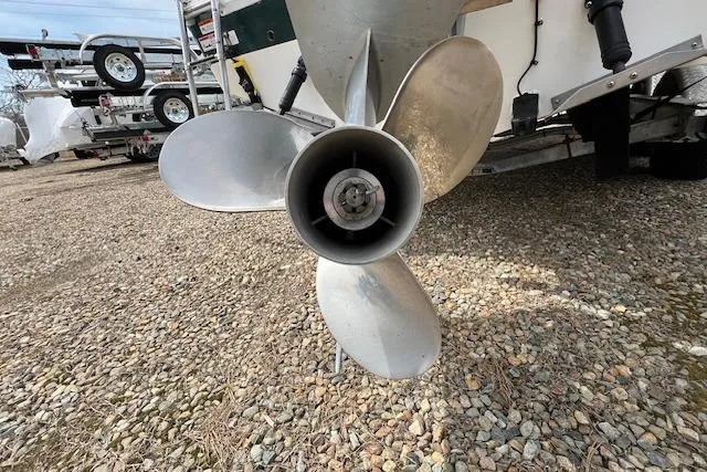 Slide: The Image of Propeller of a 2006 Striper 2301 Walkaround OB boat on gravel surface. - 5