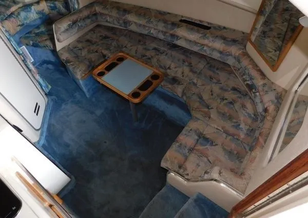 Slide: The Image of 1995 Sea Ray 330 Express Cruiser interior with blue upholstery. - 14