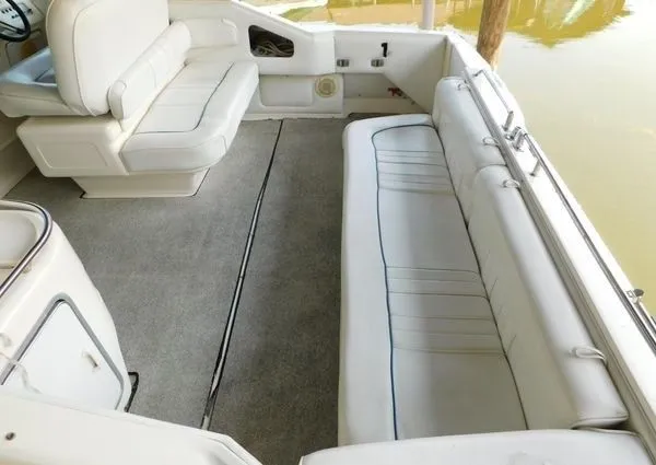 Slide: The Image of Interior of a 1995 Sea Ray 330 Express Cruiser with white seating. - 21