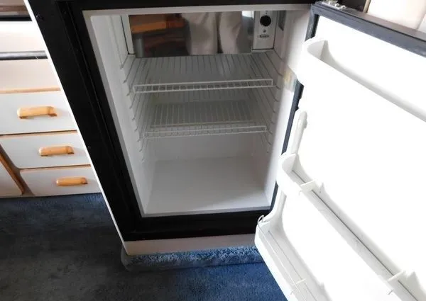 Slide: The Image of Open fridge in a 1995 Sea Ray 330 Express Cruiser yacht. - 22