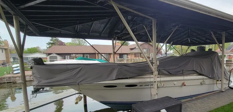 Slide: The Image of 1995 Sea Ray 330 Express Cruiser covered at dock. - 3