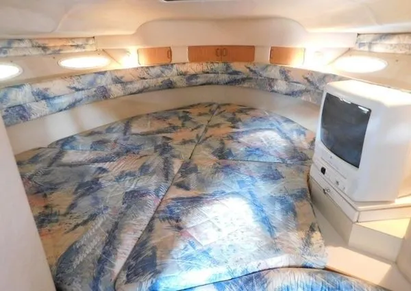Slide: The Image of Interior of 1995 Sea Ray 330 Express Cruiser with bed and TV. - 5