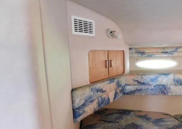 Slide: The Image of Interior of 1995 Sea Ray 330 Express Cruiser with bed and window. - 6
