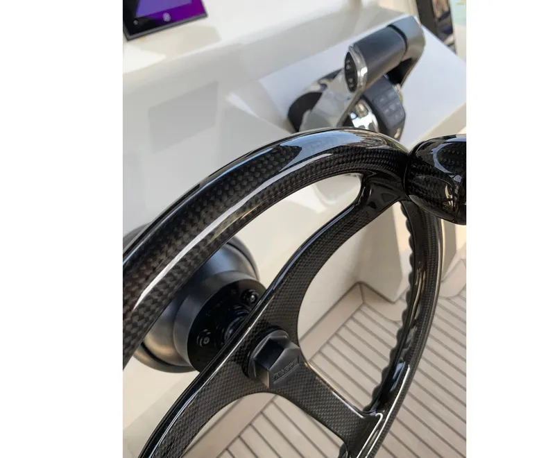 Slide: The Image of Carbon fiber steering wheel of 2019 Chaser 500R boat, showcasing modern design and technology. - 11