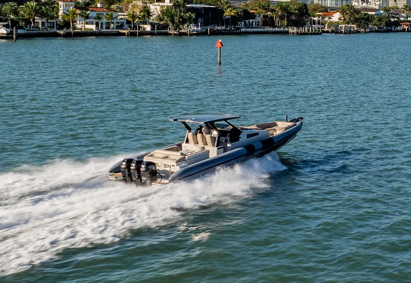 Slide: The Image of 2019 Chaser 500R speedboat cruising on a sunny day in a coastal area. - 16