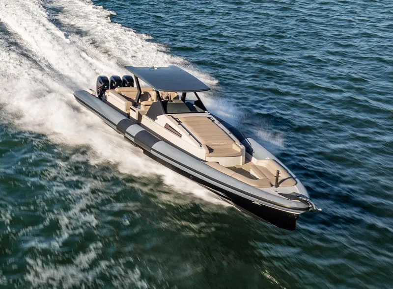 Slide: The Image of 2019 Chaser 500R speedboat cruising on open water, showcasing sleek design and powerful engines. - 2
