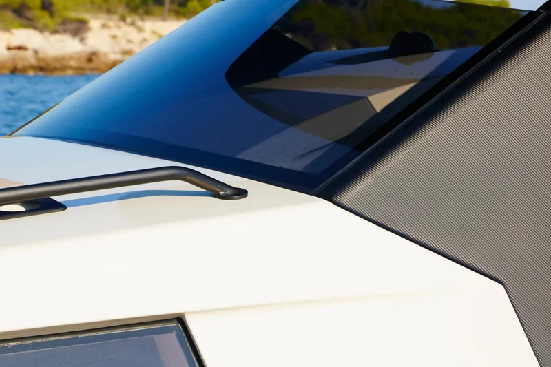 Slide: The Image of Close-up of 2019 Chaser 500R boat's sleek design and windshield detail. - 5