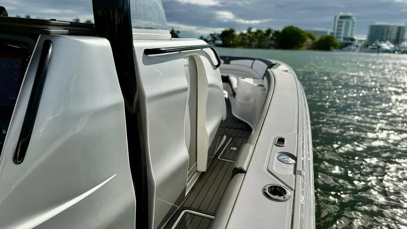 Slide: The Image of 2020 Fountain 43NX boat on water, sleek design, modern features, scenic background. - 19