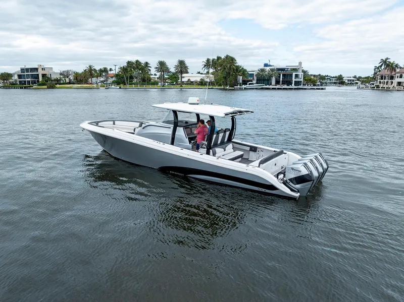 Slide: The Image of 2020 Fountain 43NX boat on water, with modern design and spacious deck. - 2