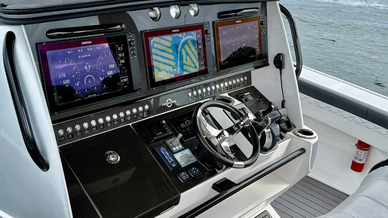 Slide: The Image of Control panel of 2020 Fountain 43NX boat with advanced navigation displays. - 22