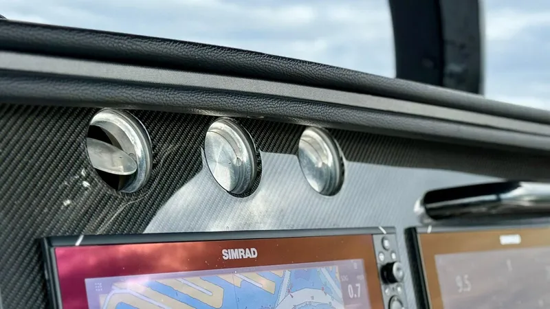 Slide: The Image of Dashboard of 2020 Fountain 43NX boat with Simrad navigation displays. - 24