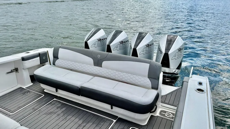 Slide: The Image of 2020 Fountain 43NX boat with quad engines and luxurious seating on the water. - 38