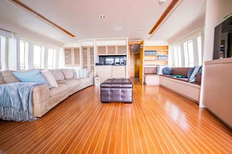 Slide: The Image of Luxurious interior of 1996 Cheoy Lee 145 Global Series yacht with elegant seating and wooden flooring. - 43