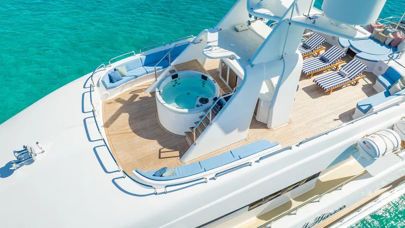 Slide: The Image of Luxurious Cheoy Lee 145 yacht deck with jacuzzi and sun loungers, 1996 model. - 7