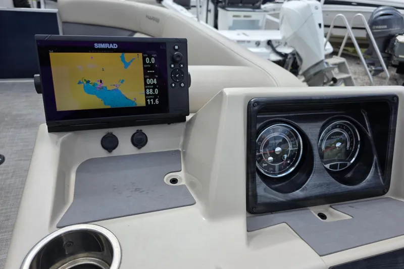 Slide: The Image of Dashboard of 2021 Harris Cruiser 230 with Simrad navigation display and gauges. - 11