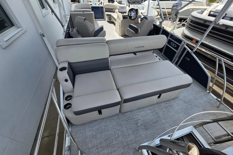 Slide: The Image of 2021 Harris Cruiser 230 boat interior with plush seating and modern design. - 8