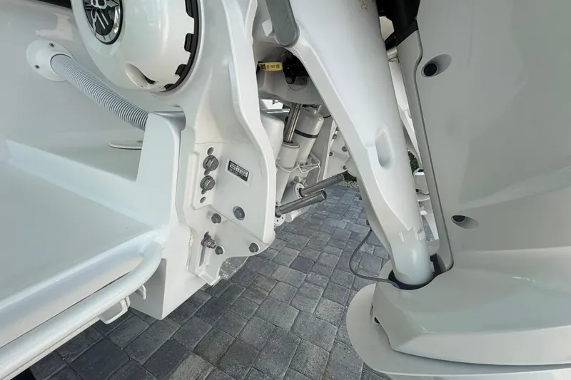 Slide: The Image of 2025 Whitewater 28 boat engine detail with hydraulic components and sleek design. - 6