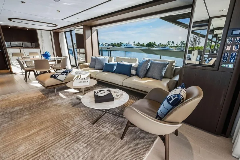 Slide: The Image of Luxurious interior of 2023 Ferretti Yachts 860 with elegant seating and scenic ocean view. - 10
