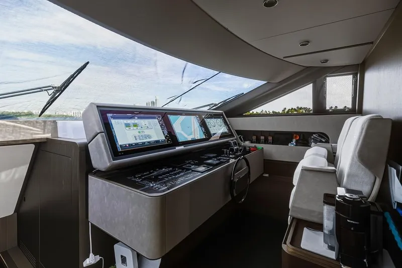 Slide: The Image of Luxurious helm of 2023 Ferretti Yachts 860, featuring advanced navigation systems and plush seating. - 19