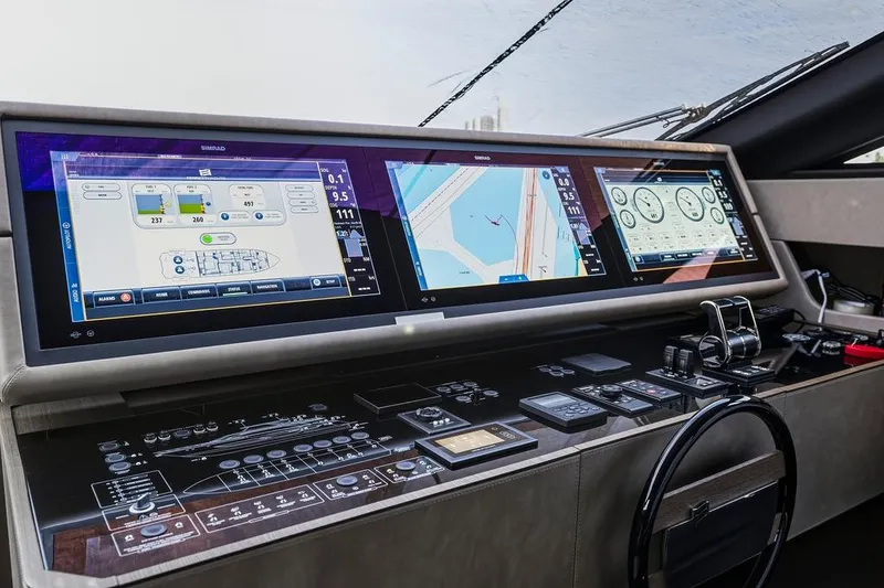 Slide: The Image of Control panel of 2023 Ferretti Yachts 860 with advanced navigation displays and controls. - 20