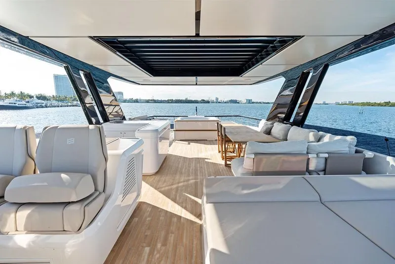 Slide: The Image of Luxurious 2023 Ferretti Yachts 860 interior with elegant seating and ocean view. - 24