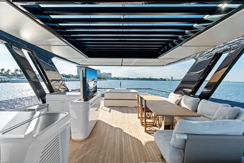 Slide: The Image of Luxurious 2023 Ferretti Yachts 860 interior with elegant seating and ocean view. - 25