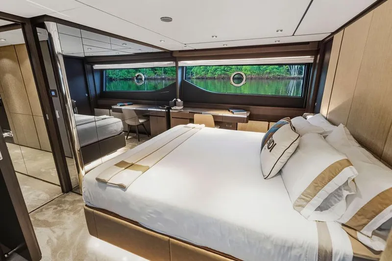 Slide: The Image of Luxurious bedroom interior of 2023 Ferretti Yachts 860 with elegant furnishings and scenic window view. - 41