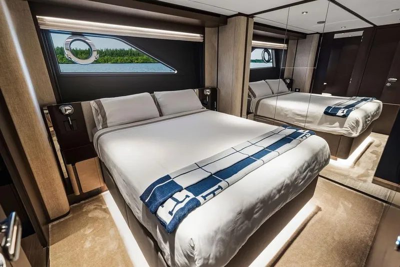 Slide: The Image of Luxurious bedroom interior of 2023 Ferretti Yachts 860 with elegant design and scenic window view. - 49
