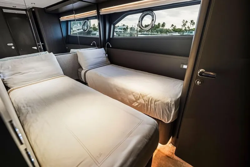 Slide: The Image of Luxurious twin bedroom in 2023 Ferretti Yachts 860, featuring modern design and porthole view. - 54