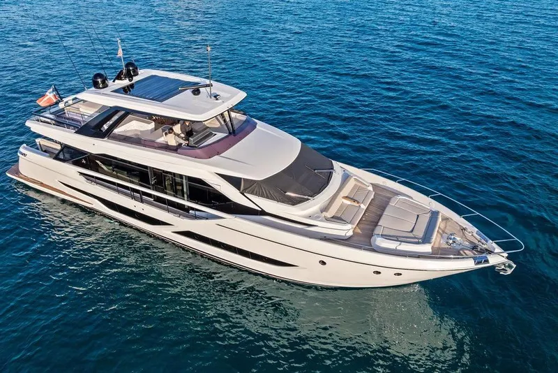 Slide: The Image of Luxurious 2023 Ferretti Yachts 860 cruising on clear blue waters. - 8