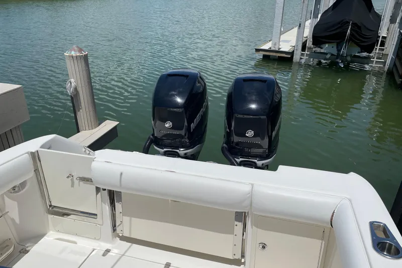 Slide: The Image of 2009 Boston Whaler 280 Outrage with twin Mercury outboard engines docked. - 13