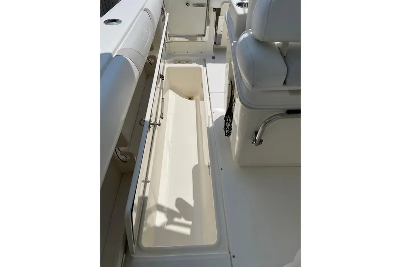 Slide: The Image of 2009 Boston Whaler 280 Outrage interior storage compartment, showcasing spacious design. - 18