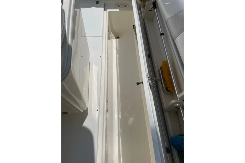 Slide: The Image of Storage compartment on a 2009 Boston Whaler 280 Outrage boat, featuring clean interior. - 19