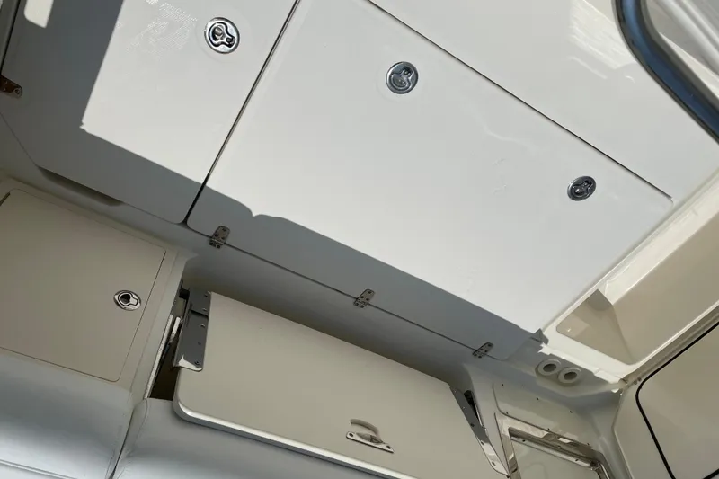 Slide: The Image of 2009 Boston Whaler 280 Outrage storage compartments with secure latches and sleek design. - 20