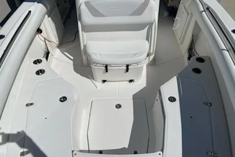Slide: The Image of 2009 Boston Whaler 280 Outrage boat interior with seating and storage compartments. - 24