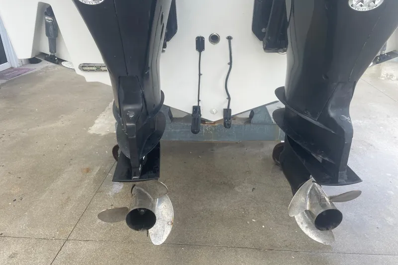 Slide: The Image of Rear view of 2009 Boston Whaler 280 Outrage with dual outboard motors. - 27