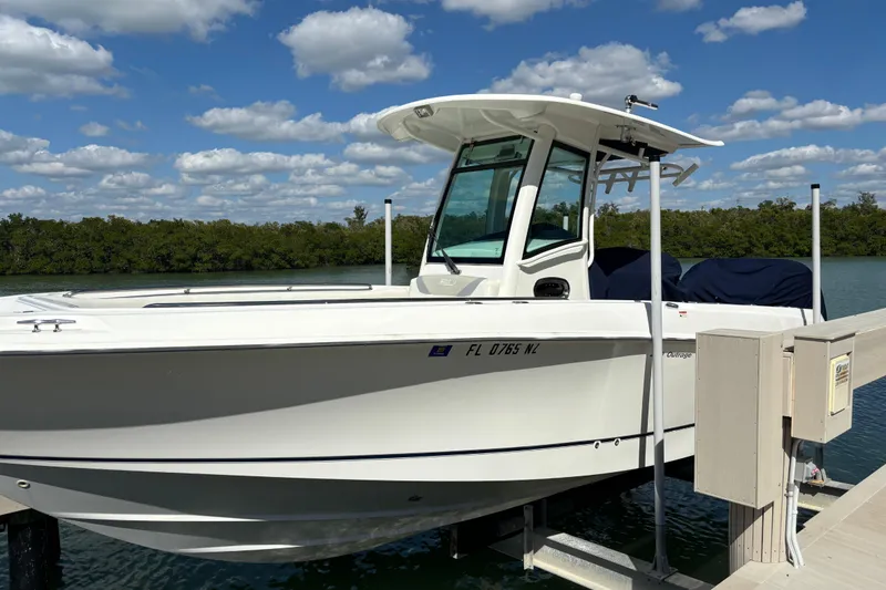 Slide: The Image of 2009 Boston Whaler 280 Outrage boat docked on a sunny day with blue skies. - 33