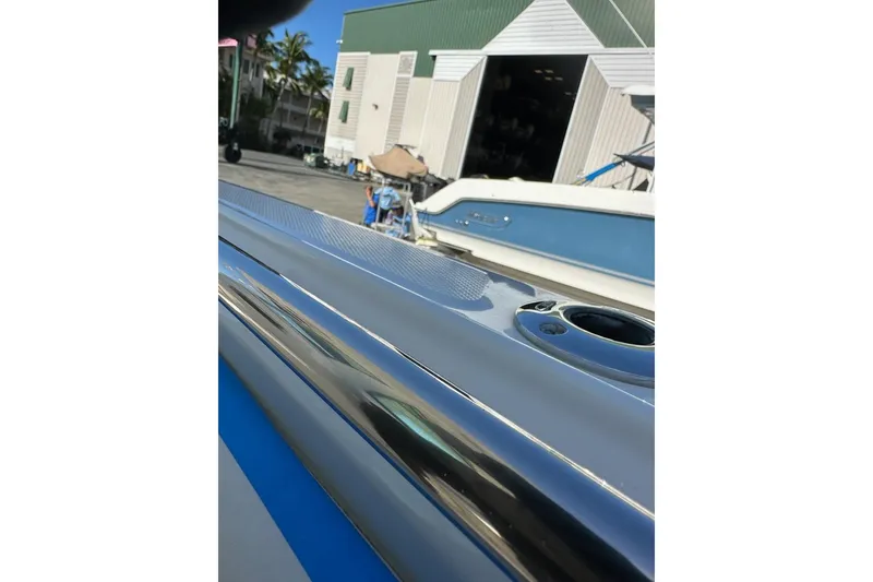 Slide: The Image of 2009 Boston Whaler 280 Outrage boat detail with marina background. - 34