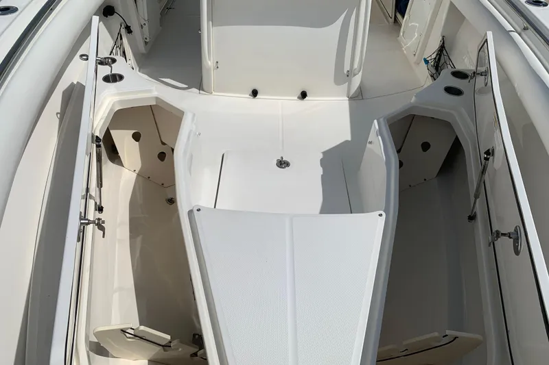 Slide: The Image of 2009 Boston Whaler 280 Outrage boat interior with open storage compartments. - 7