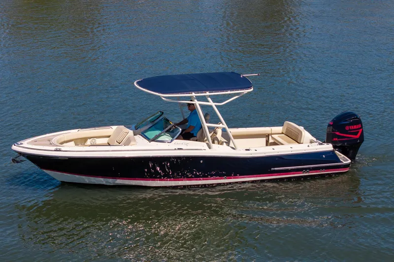 The Image of 2017 Chris-Craft Calypso 26 boat cruising on water with Yamaha outboard motor. - 1