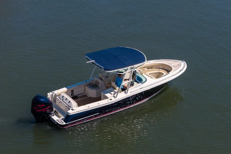 Slide: The Image of 2017 Chris-Craft Calypso 26 boat with Yamaha engine on calm water. - 6