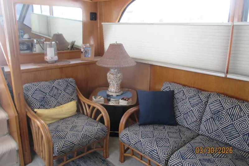 Slide: The Image of Cozy interior of 1989 Chris Craft 427 yacht with patterned seating and decorative lamp. - 10