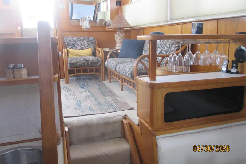 Slide: The Image of Interior of 1989 Chris Craft 427 yacht with cozy seating and elegant decor. - 22