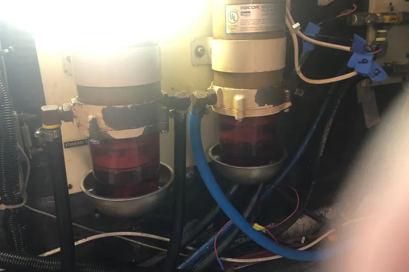 Slide: The Image of Engine compartment of 1989 Chris Craft 427 with Racor fuel filters and wiring. - 50