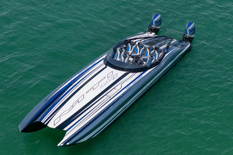 The Image of 2024 MTI 440X speedboat on water, featuring sleek design and powerful engines. - 0