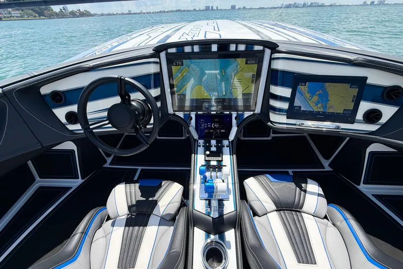 Slide: The Image of Cockpit of 2024 MTI 440X boat with advanced navigation displays and sleek design. - 7